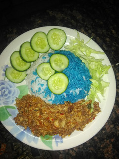 A picture of Blue rice with fish source.