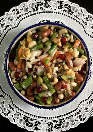 A picture of Zesty Three-Bean Salad with Walnuts and Pomegranates.
