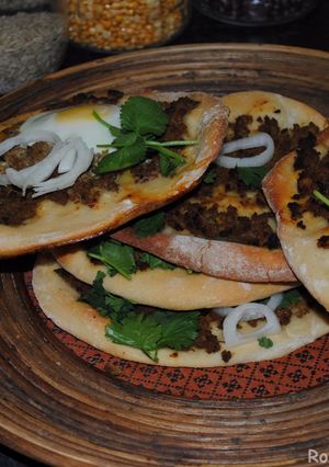 A picture of Pizza with minced beef and egg.