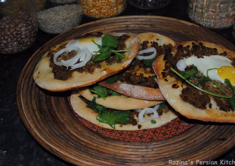 Pizza with minced beef and egg