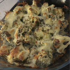 A picture of Baked Broccoli marinated with yogurt and topped with mozzarella.