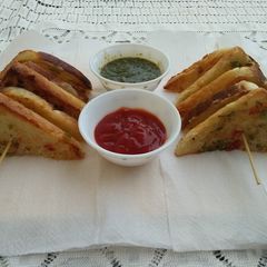 Rava Toast with Coriander chutney &Tomato sauce A picture of Rava Toast with Coriander chutney &Tomato sauce.