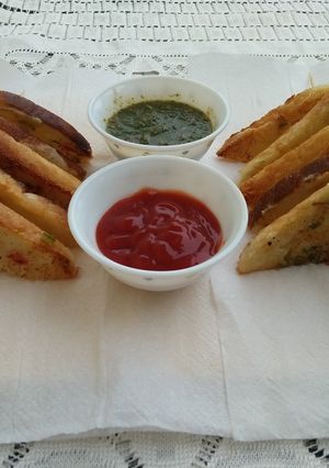 A picture of Rava Toast with Coriander chutney &Tomato sauce.