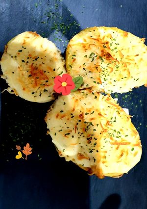 Foto principal de Patatas rellenas de champiñones y bechamel