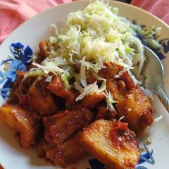 A picture of Masala potatoes and streamed cabbage.