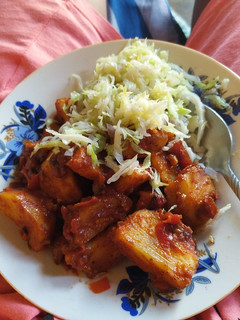 A picture of Masala potatoes and streamed cabbage.