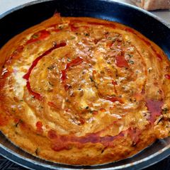 A picture of Methi matar Malai in red gravy.