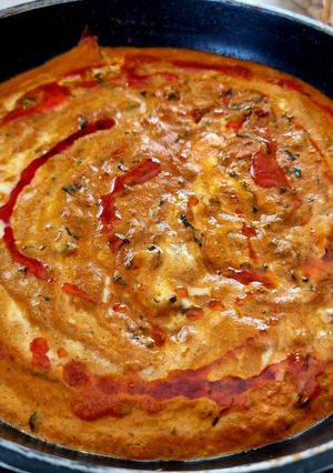A picture of Methi matar Malai in red gravy.