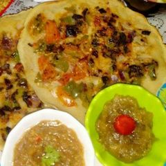 A picture of Amla uttapam with amla chutney and amla jam.