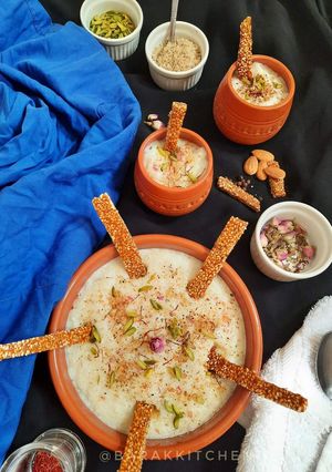 A picture of Thandai kheer served with Thandai flavoured Sesame Chikki.