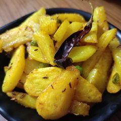 A picture of Jeera aloo matar fry without onion garlic.