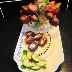 A picture of Chocolate dipped strawberries And Almond-stuffed dates:.