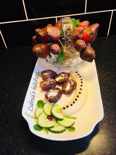 A picture of Chocolate dipped strawberries And Almond-stuffed dates:.