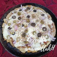 Tawa Veg Pizza with Olives A picture of Tawa Veg Pizza with Olives.