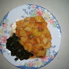 A picture of Matoke and fried spinach.