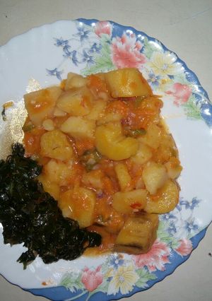 A picture of Matoke and fried spinach.