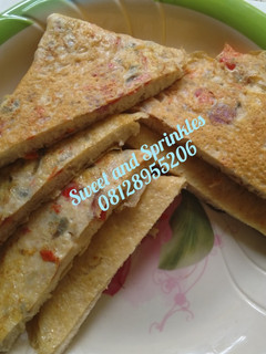 A picture of Bread in egg sandwich.