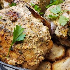 A picture of Roasted Cornish Hens over French Breads with a Rich Creamy Top.