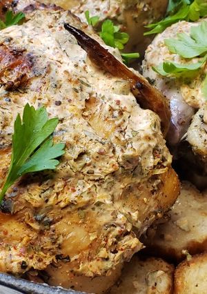A picture of Roasted Cornish Hens over French Breads with a Rich Creamy Top.