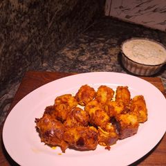 A picture of Peri peri tandoori soya chap with curd dressing / dip.