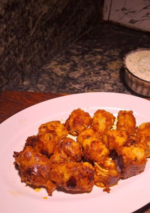 A picture of Peri peri tandoori soya chap with curd dressing / dip.