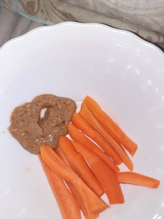A picture of Carrot + Peanut butter snack.