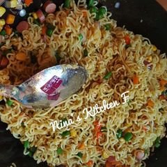 A picture of Stir fry noddles with veggies.