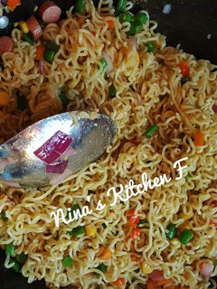 A picture of Stir fry noddles with veggies.