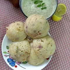 A picture of Oats rava idlies with the stuffing ofveggies nuts and fruits.