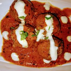 A picture of Kaddu kofte with gravy.