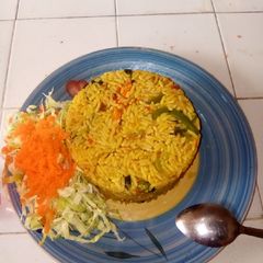 A picture of Fried rice with with salad.