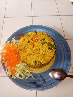 A picture of Fried rice with with salad.