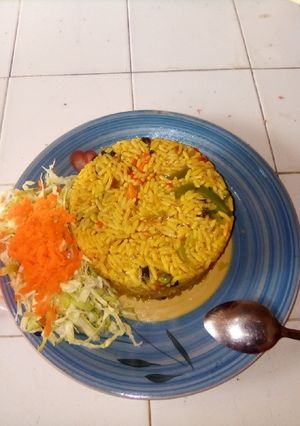 A picture of Fried rice with with salad.
