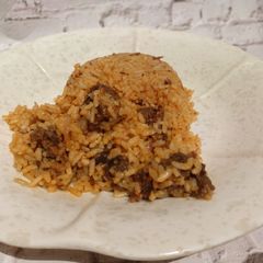 A picture of Fried beef jollof rice.