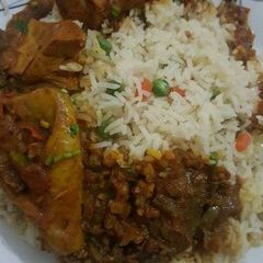 A picture of Vegetables rice with beef stew.