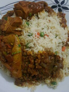 A picture of Vegetables rice with beef stew.