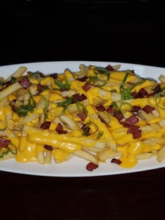 A picture of Cheddar fries.