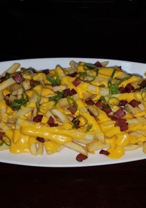 A picture of Cheddar fries.