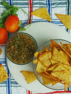 A picture of Fresh Corn Nacho Chips With Smoked Tomato Salsa.