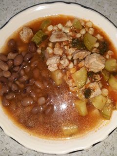 A picture of Pork with Zucchini and Corn.