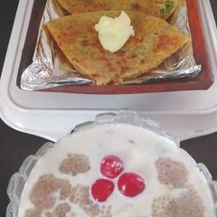 A picture of Club Stuffed Parathas with Sprouts Chia Seeds Raita.