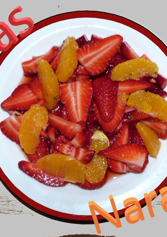 Una foto de Fresas y naranjas