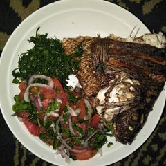 A picture of Kachumbari with fish and greens.