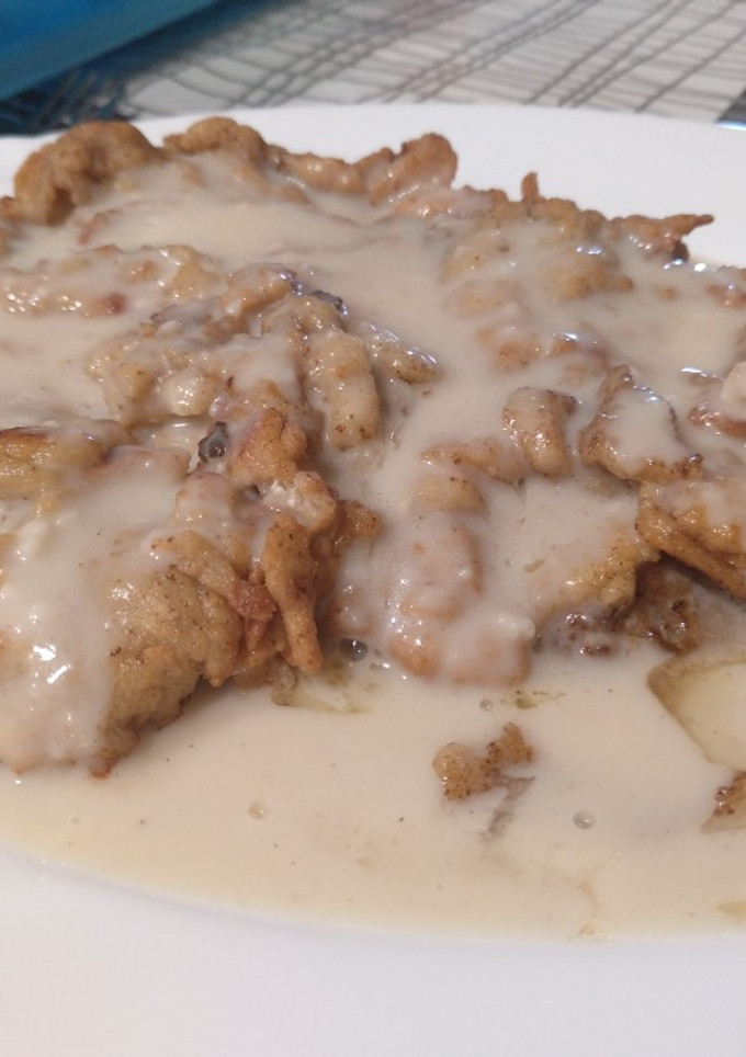 Una foto de Ternera con rebozado especial y salsa gravy