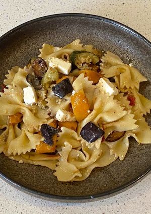 A picture of Pasta with roasted vegetables and feta cheese salad.