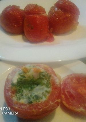 A picture of Oven baked stuffed tomatoes.
