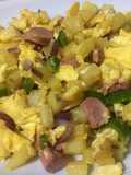 Scrambled egg with potato and sausages