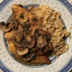A picture of Chicken Francese with Mushrooms and Capers.