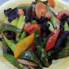 A picture of Stir fry Asparagus with black fungus.