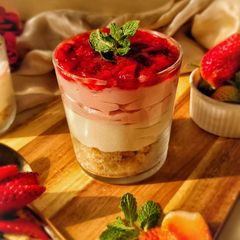 A picture of 3 layered Strawberry Cheesecake.